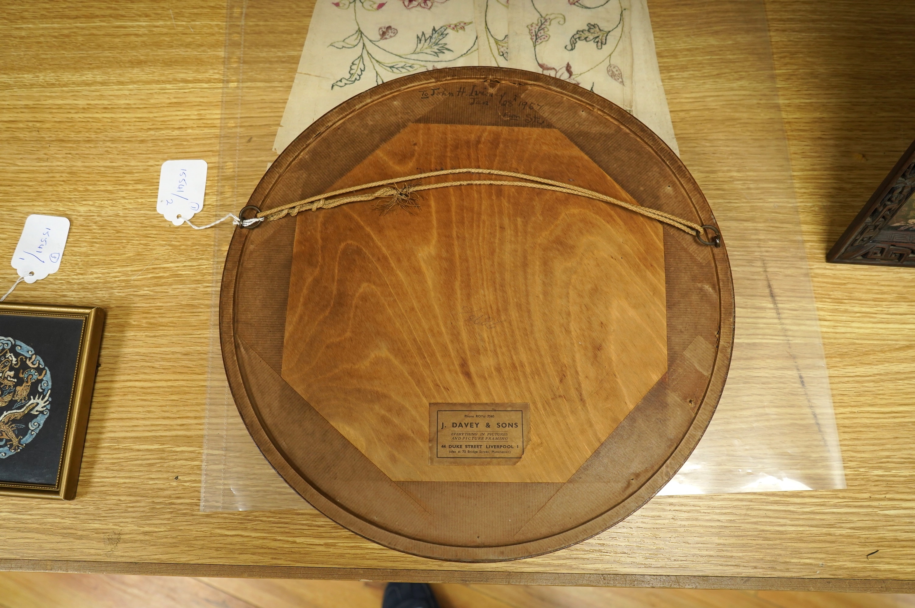 A framed, 19th century, possibly Scandinavian, red felt circular multi-coloured silk embroidery of flowers, acorns and leaves, also embroidered with fine stump work style beadwork flower detail, 32cm diameter. Condition